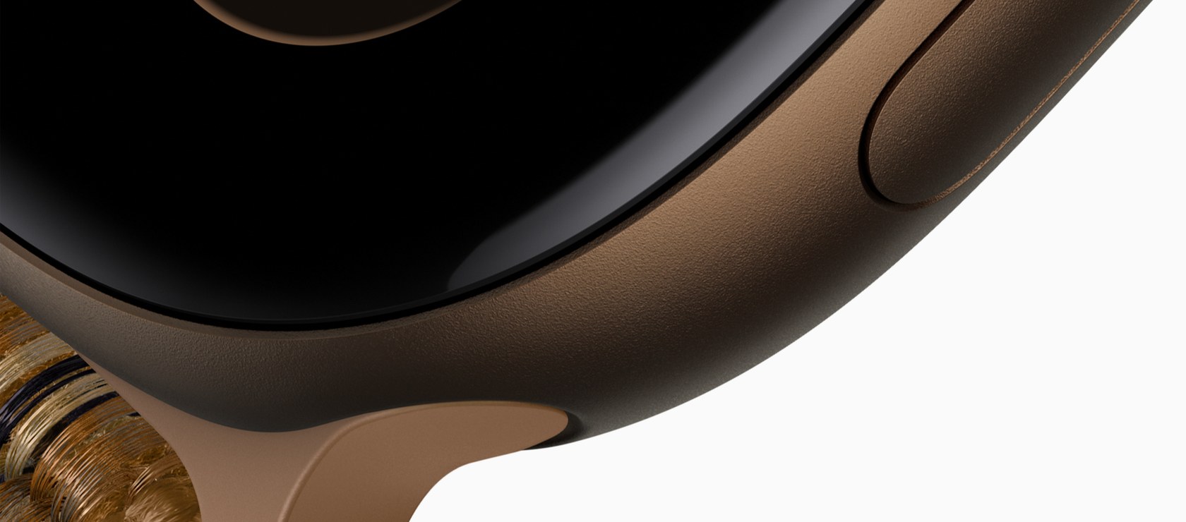 Apple Watch Series 12のダークブロンズのアルミニウムケースを斜めから撮った接写。丸みのある黒いガラス面と、側面のサイドボタンが写っている。