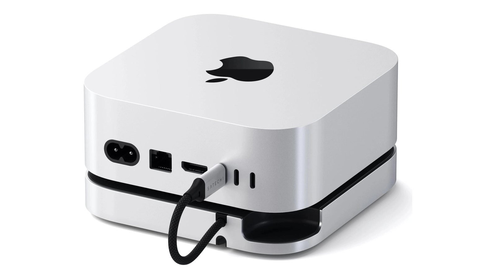 Mac miniを載せた状態を背面から見たところ。台から出た短いUSB-Cケーブルが背面のポートに挿さり、台の後ろ側には電源ボタンに指が届く切り欠きが開いている。